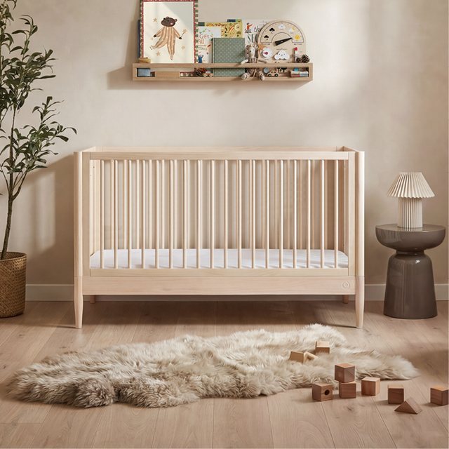 Gaia Baby Eos cot bed in natural ash in a nursery